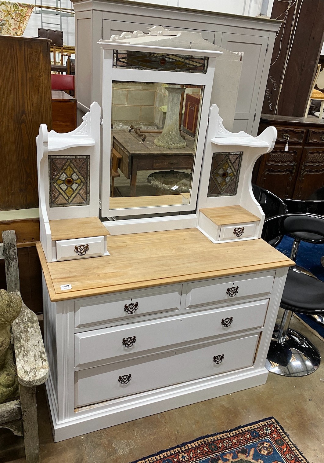 An Edwardian later painted beech dressing chest, with inset stained glass panels, width 116cm